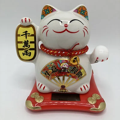 Waving cat