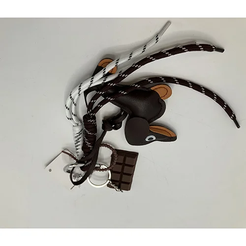 Mobello — Mobile charm dog with chocolate and laces