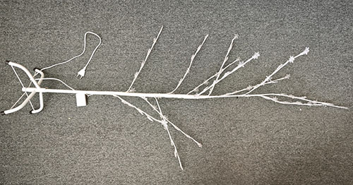 Illuminated tree with plastic end of LED light sources in the shape of a snowflake