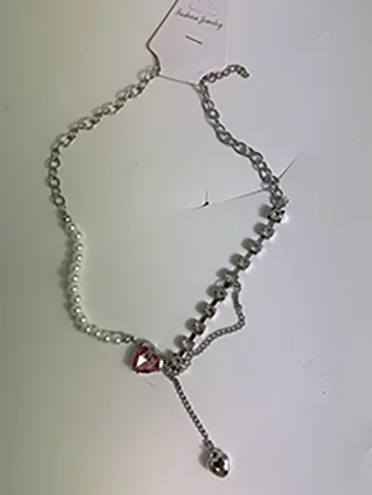 Fashion jewellery — Necklace with heart-shaped pendant and rhinestones