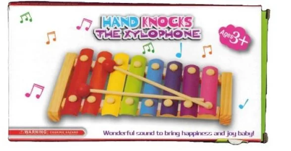 Hand knocks the xylophone
