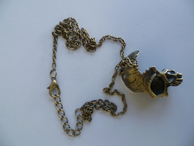 Halskette, "Mad Moonshine Halskette Brass Half Face Human Skull"
