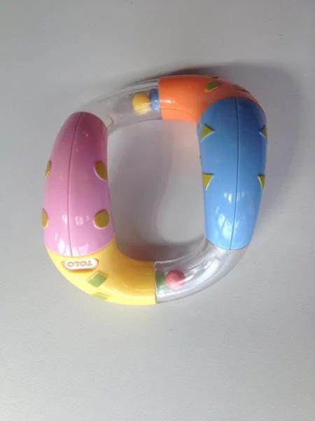 1) Tolo, 2) Tolo / Marks and Spencer (M&S) — Twist & Turn Rattle